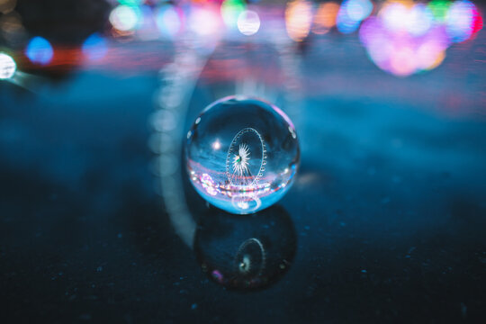 Picture of a nighttime water reflection in a theme park