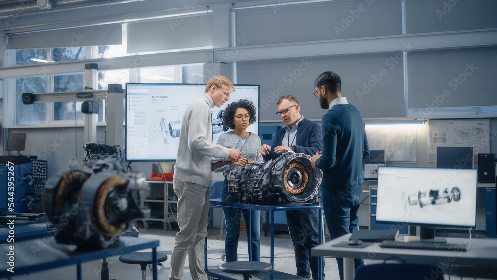 Poster diverse intelligent engineers work together on functions modification of electric engine for innovat