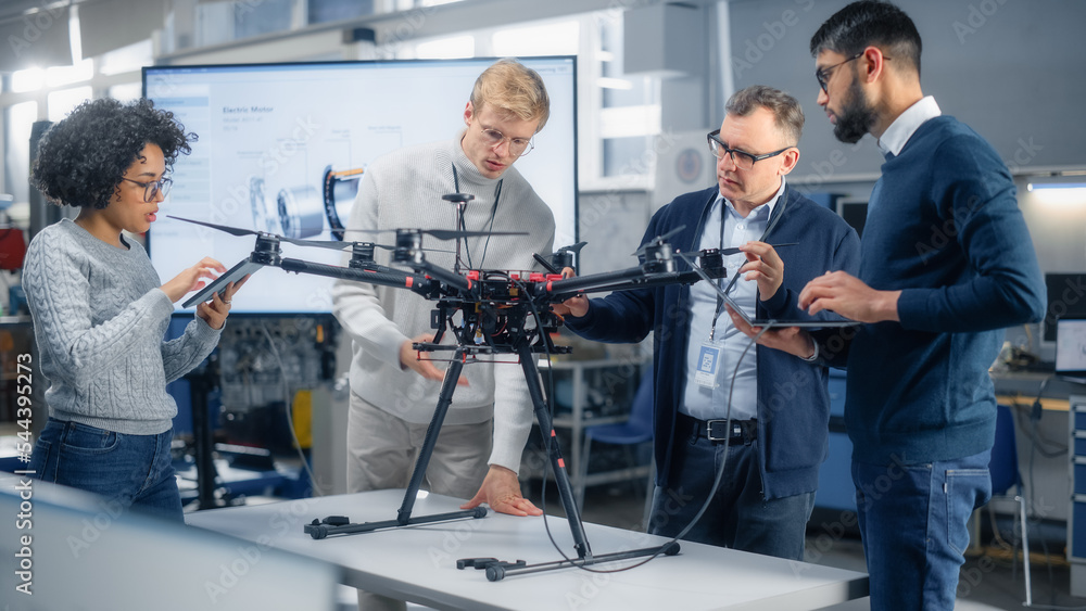 Aufkleber Enthusiastic Diverse Engineers Have Energetic Discussion About Remote Control Drone Design. Intelligent People Programming and Developing High Tech Flying Device for Shipping or Surveillance.