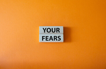 Your fears symbol. Wooden blocks with words Your fears. Beautiful orange background. Business and Your fears concept. Copy space.