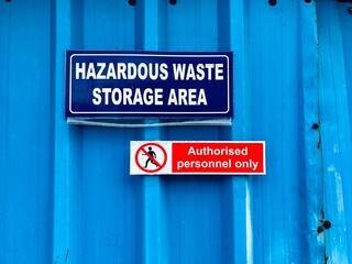 Industrial warning sign board for denoting hazardous waste chemicals storage area. Warning sign for alerting employees working in the factory.