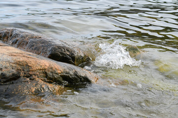 Movement of sea water against the shore