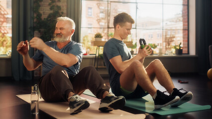 Middle Aged Man Exercising at Home with Personal Trainer. Senior Male Strengthening Muscles with...