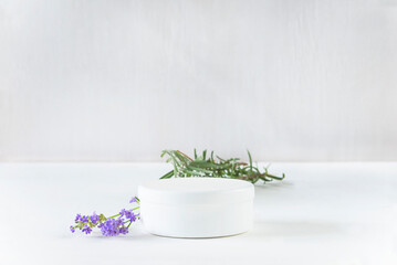 White container podium and lavender plant on white background with sunlight and shadow; Minimalist...