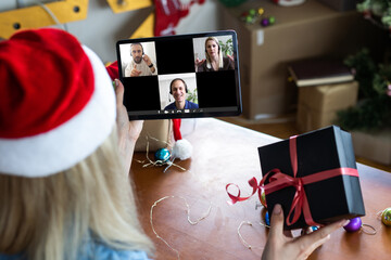 Virtual Christmas tree meeting team teleworking. Family video call remote conference. Laptop webcam...