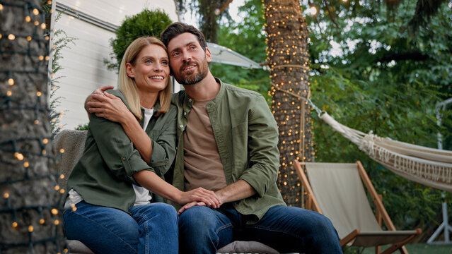 Spouses Caucasian woman and man married couple husband and wife girlfriend and boyfriend outdoors talking planning idea conversation dreaming about future discus dream on backyard in camping together - Powered by Adobe