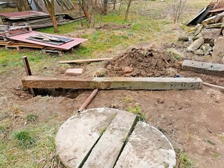 Hard work in the garden, pulling a concrete post out of the ground