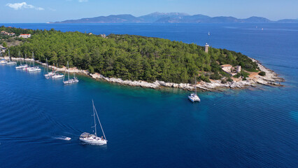 Aerial drone photo of luxury sail boat anchored in tropical Caribbean limestone turquoise colour...
