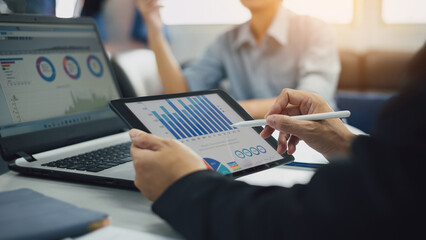 Two businessman consult analyzing company financial cash flow result. Concept for teamwork business corporate and economy fund.