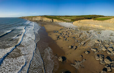 Aerial view of the limestone cliffs and beach at Southerndown and Dunraven Bay in Wales
