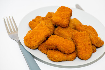 Fried chicken nuggets isolated on white background
