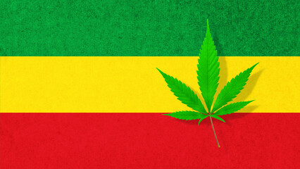 Cannabis hemp leaf on rasta flag colors background.