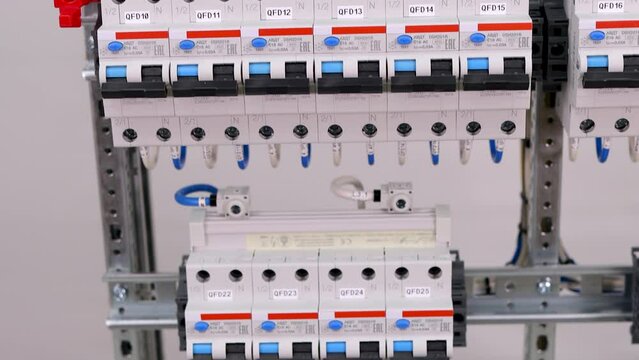 current circuit breakers and voltage distribution busbars in the electrical panel.