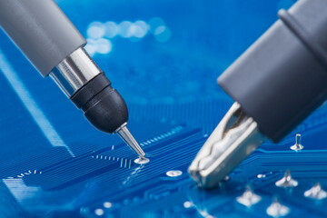 Measuring electronic signal using oscilloscope on the PCB. Electronics repair and digital...