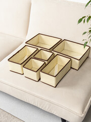 Set of laundry organizers for wardrobe of different sizes. Concept of order in house. Beige gray...