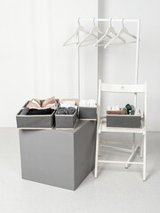 Set of laundry organizers for wardrobe of different sizes. Concept of order in house. Gray closet...