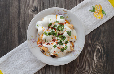 Turkish ravioli with yufka, yoghurt and minced meat; Its Turkish name is yufkalı high society ravioli.