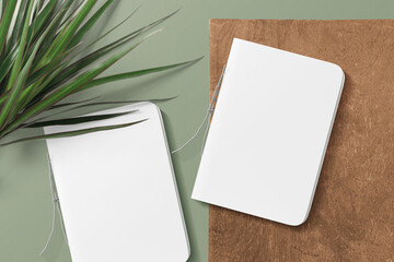 Clean minimal cover notepads mockup on top wooden with leaves
