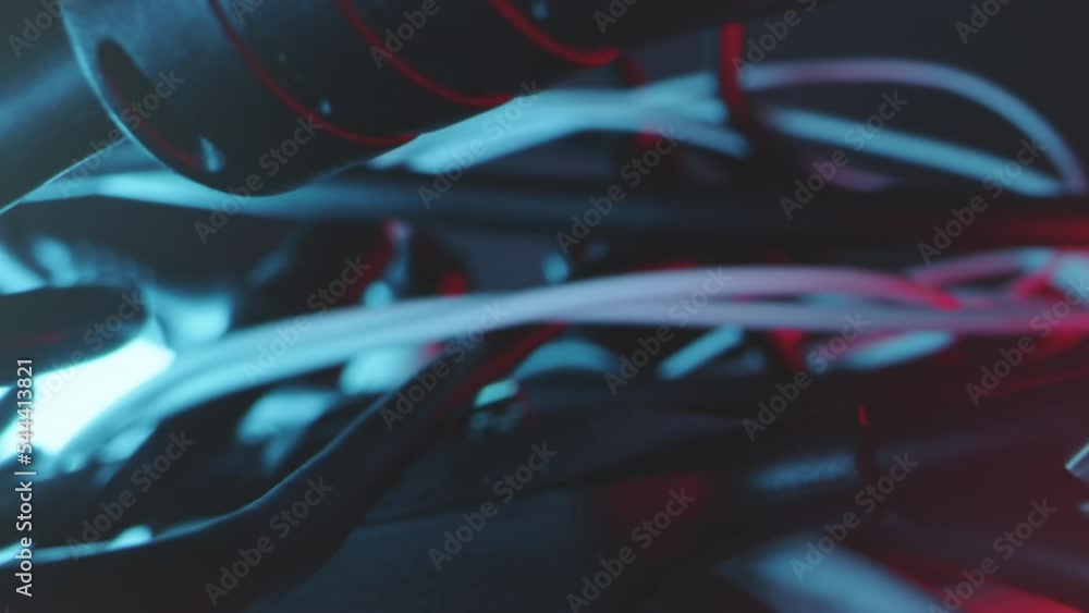 Poster tracking shot of tangle of different cables and adapters in technical light