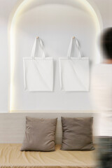 Clean minimal bag canvas hanging mockup on white wall with people walking blur foreground