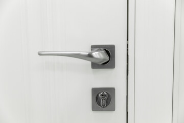door handle on a white door, door element.