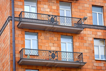 Balcony on facade of old residential building. Stalinist architecture. Stalin Empire style....
