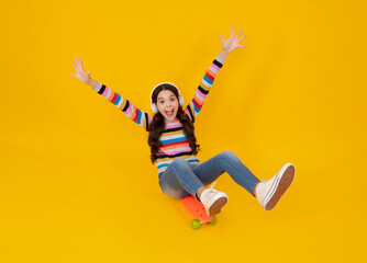 Teen school girl with skateboard on studio isolated background. Schoolgirl trend, urban teenager style. Happy teenager, positive and smiling emotions of teen girl.