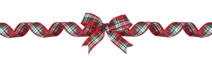 Red, green and white plaid Christmas gift bow and ribbon. Long border, curled, isolated on a white...