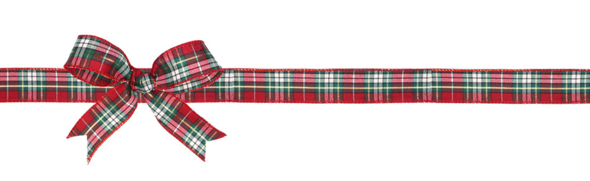 Red, green and white plaid Christmas gift bow and ribbon. Long border isolated on a white background.