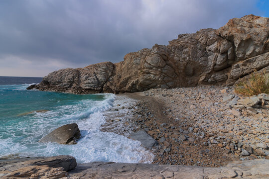 Rugged rock formation at a small hidden cove near Nonouras, Ikaria, Greek Island