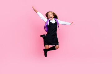 Full size photo of nice smart schoolgirl with flattering hairdo dressed school uniform falling scream isolated on pink color background