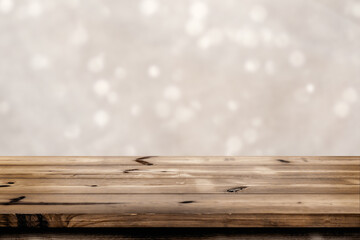 Empty wooden table for product placement or montage with focus to the table top blurred bokeh background, suitable for montage product
