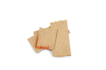 a pile of broken untreated mdf slabs of brown color on a white background close-up