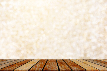 abstract blur gold color background with star glittering light and table wood for show,promote and...