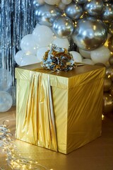 New Year and Christmas decoration at home. Boxes with gifts of gold color.
