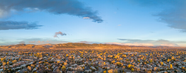 Obraz premium November sunrise over Fort Collins and foothills of Rocky Mountains in northern Colorado, aerial panorama