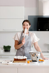 The confectioner prepares a delicious dessert in the kitchen. cooking. High quality photo