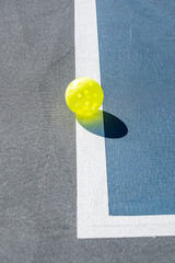 People Playing pickleball outdoors.  