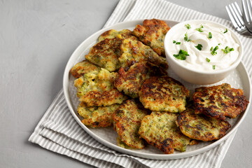 Homemade Broccoli Cheddar Fritters on a Plate, side view. Copy space.