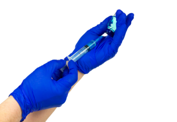 We draw out the injection liquid or vaccine with a syringe. Doctor's hands in blue gloves draw a solution into a syringe from an ampoule