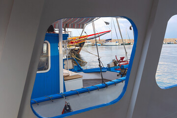 view through the window of the yacht on the ships in the parking lot in a quiet bay of the island of Cyprus in the Mediterranean Sea