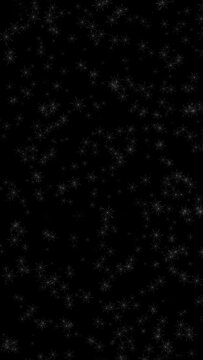 Artistic illustrated snowflakes falling down on clean black copy space vertical animation background.
