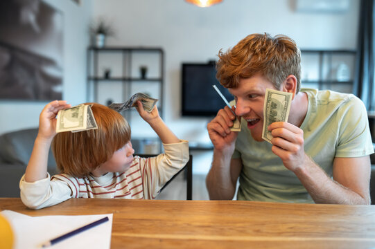 Dad Teaching His Little Son The Financial Basics