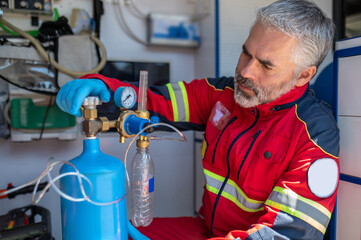 Focused ambulance physician using the oxygenation equipment