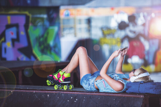 Roller skater girl with gadget