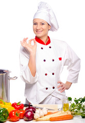 Woman chef cooking soap with different vegetables  isolated on white background