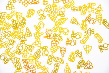 Curly vermicelli for children in the form of toys on a white background.