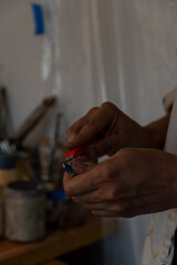 painting on blank canvas, hispanic woman with brushes and oil painting