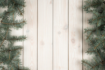 Christmas greeting wallpaper banner with evergreen tree branch decoration and wooden space in center. Background, mockup