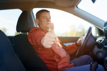 The driver shows a class gesture with his hand.
